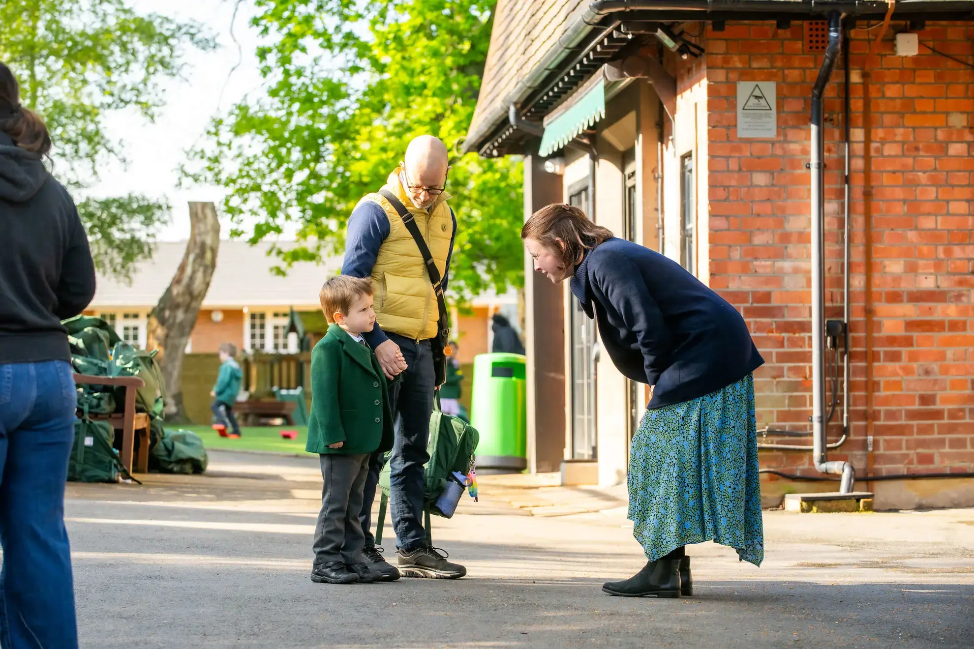 Student and parent talking to teacher