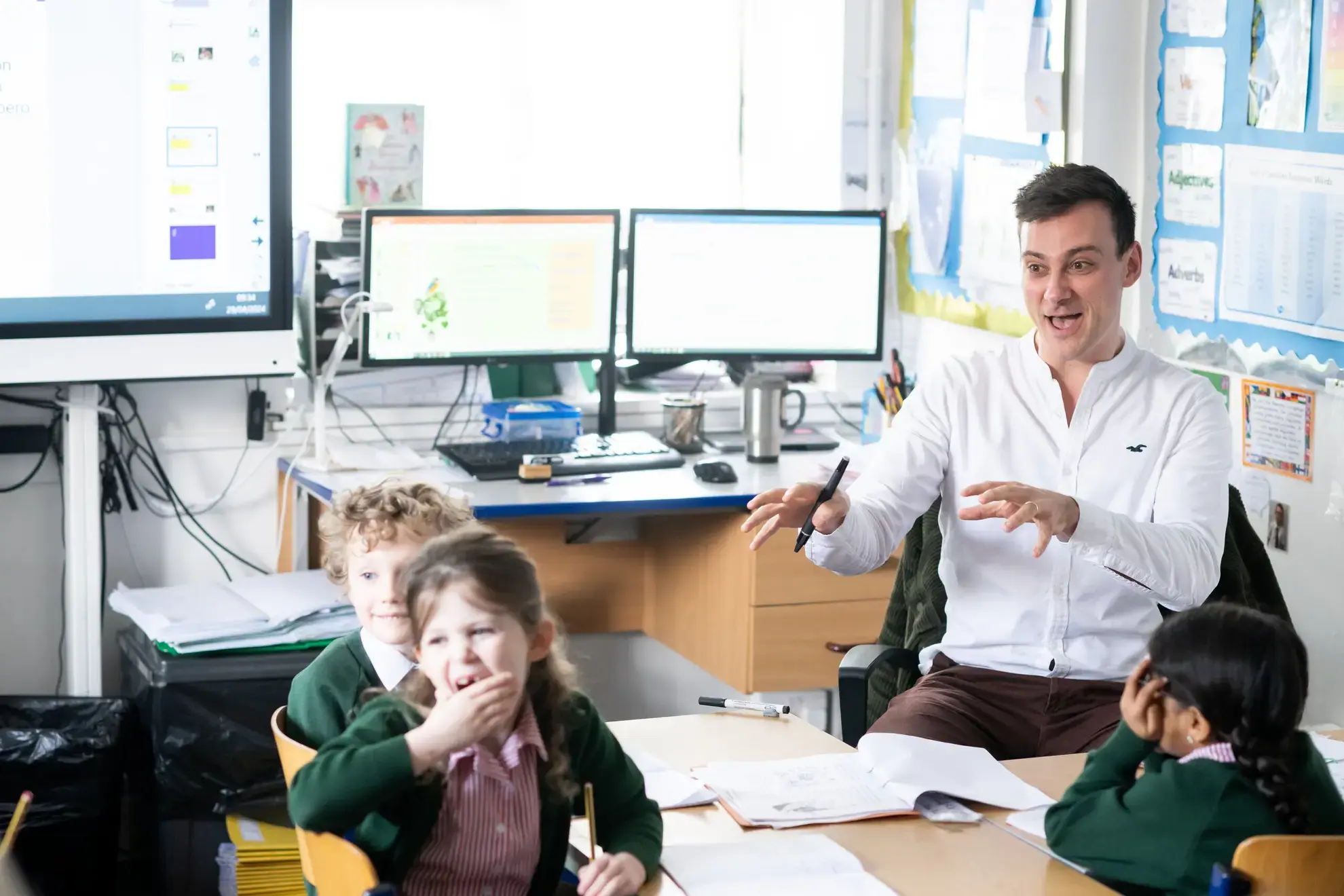 Teacher presiding at front of class