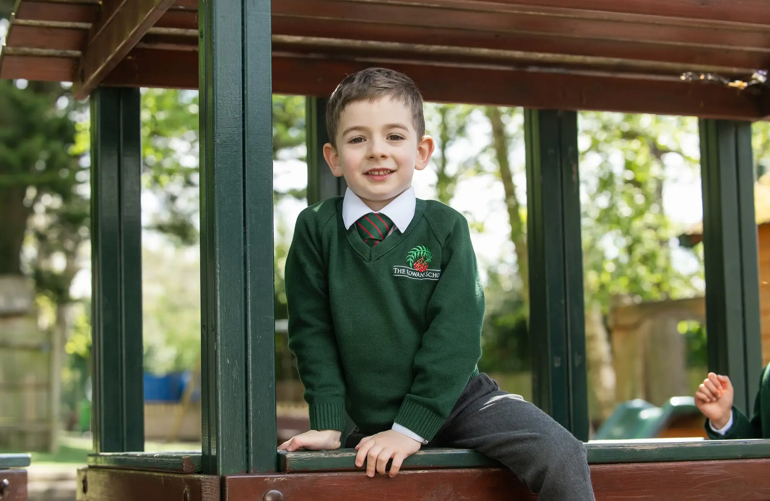 Student climbing on playground equipmemt