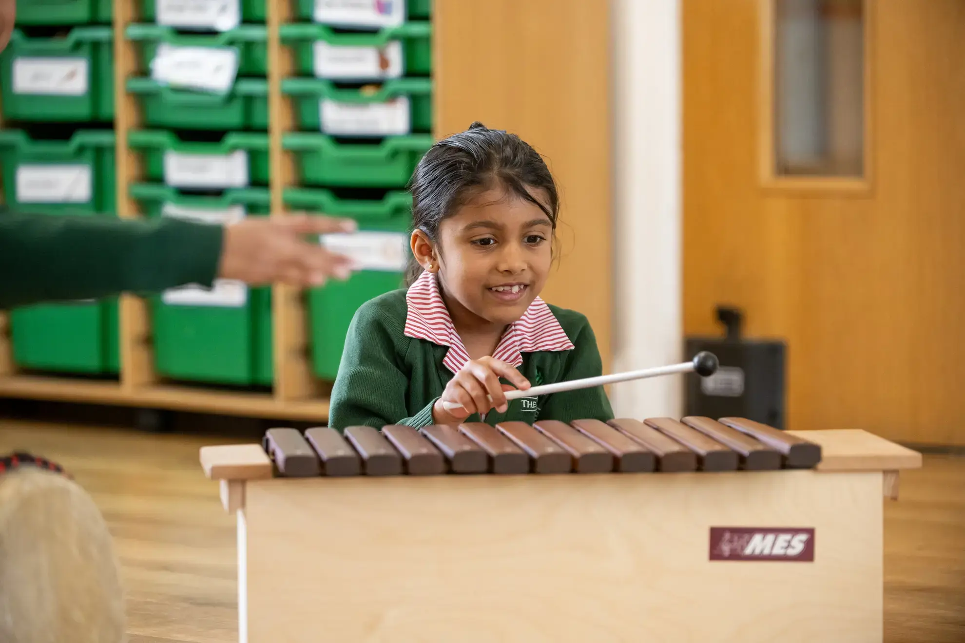 Student playing xylophone