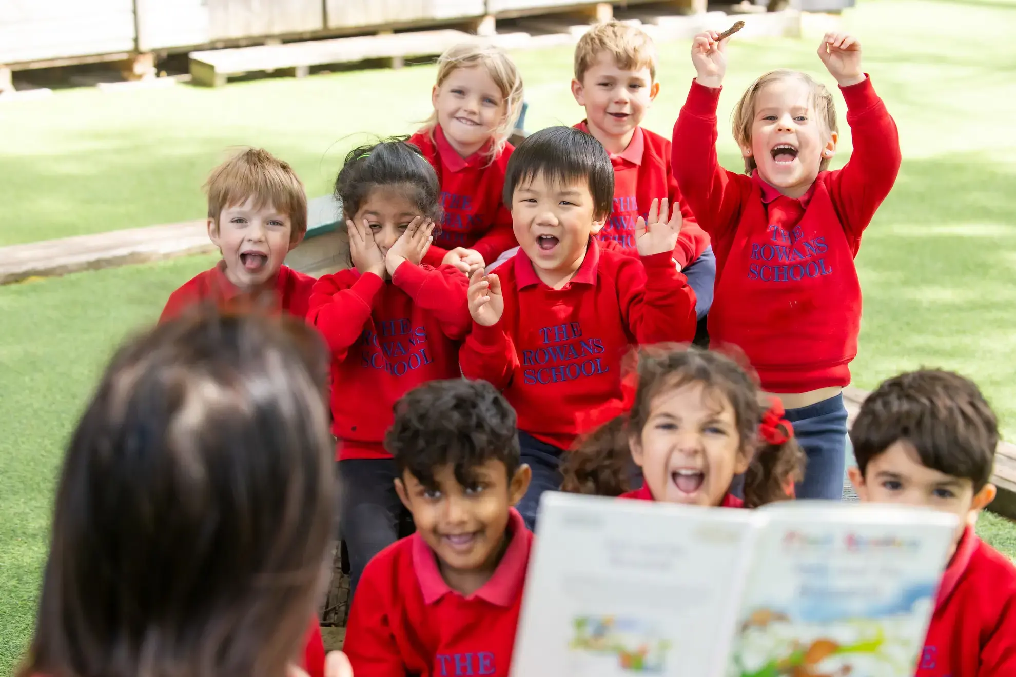 Young students excitedly reacting to storytime