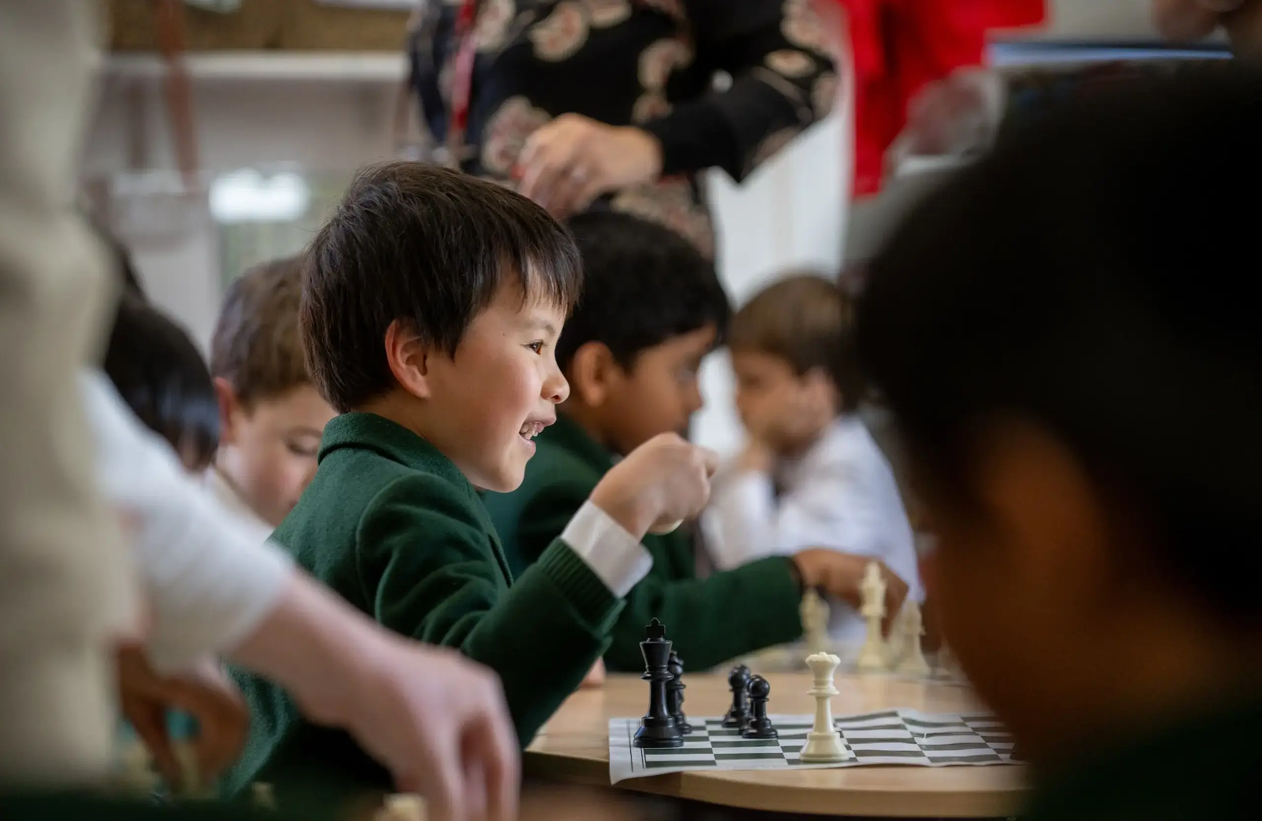 Student happily playing chess