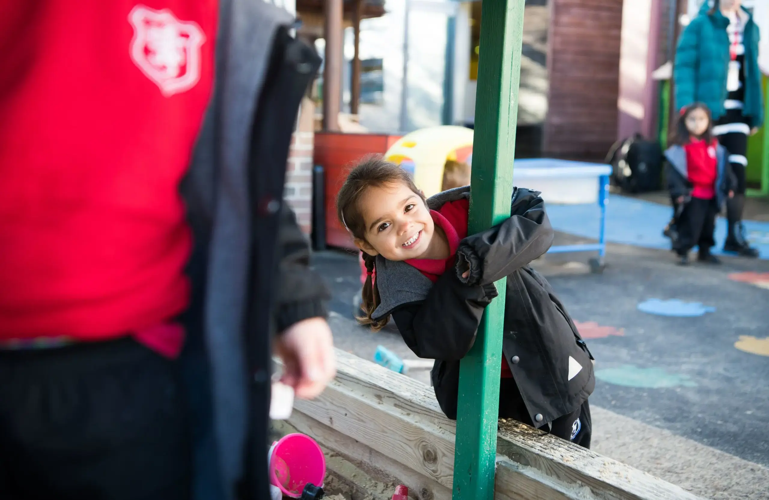 Students cheerfully playing on playground