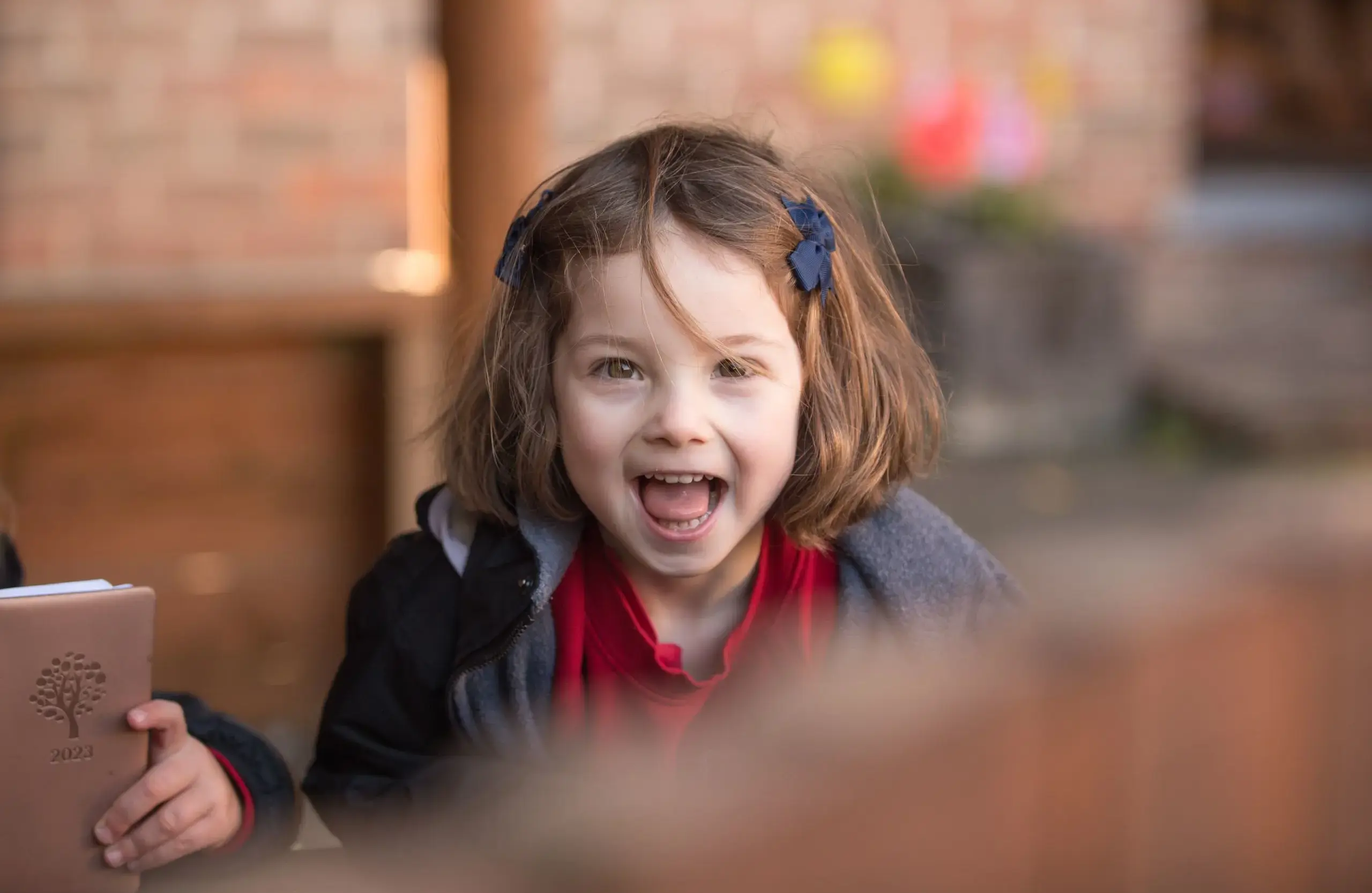 Student excitedly smiling on playground