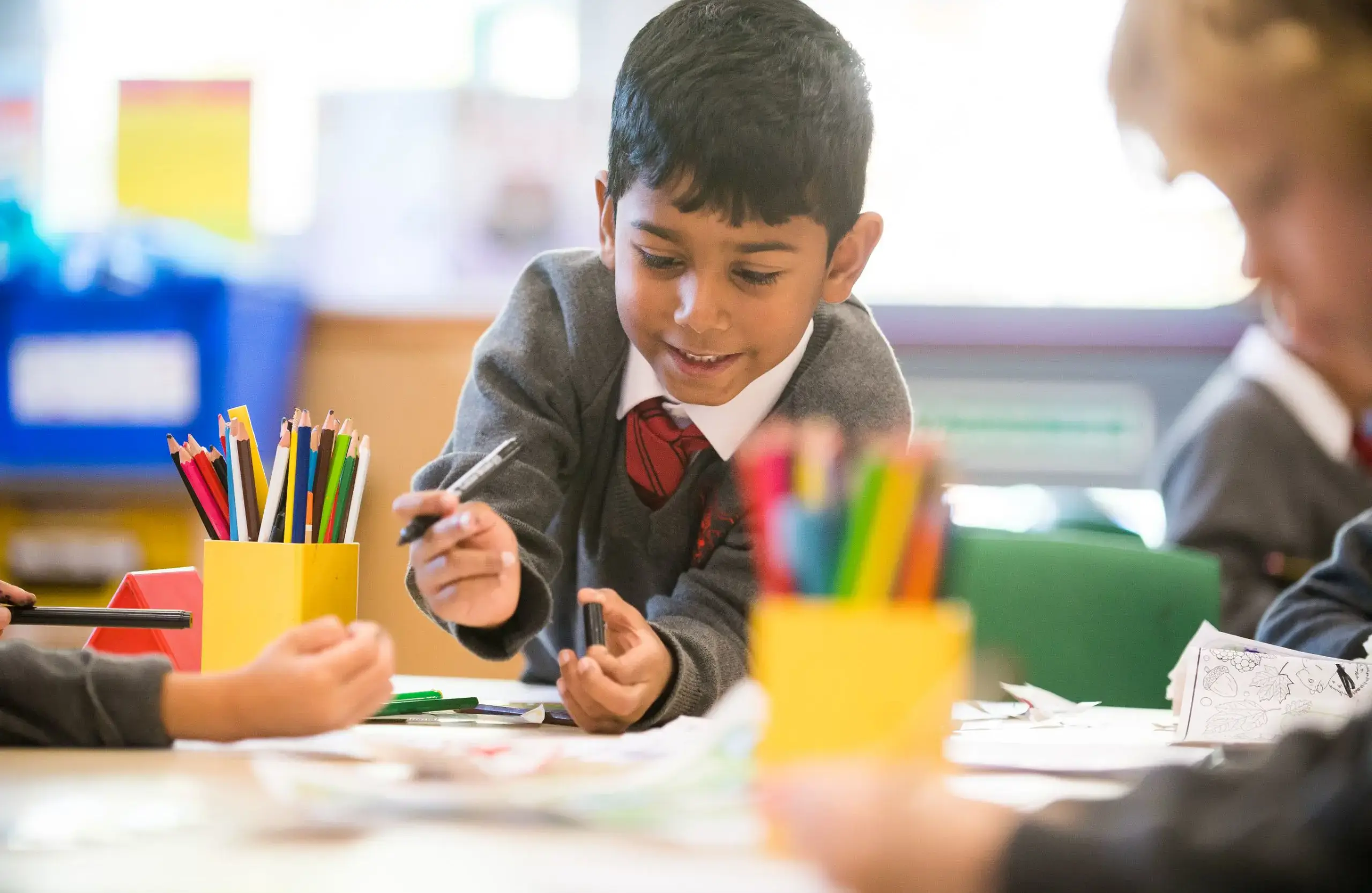 Shrewsbury House Pre-Prep student writing in a lesson