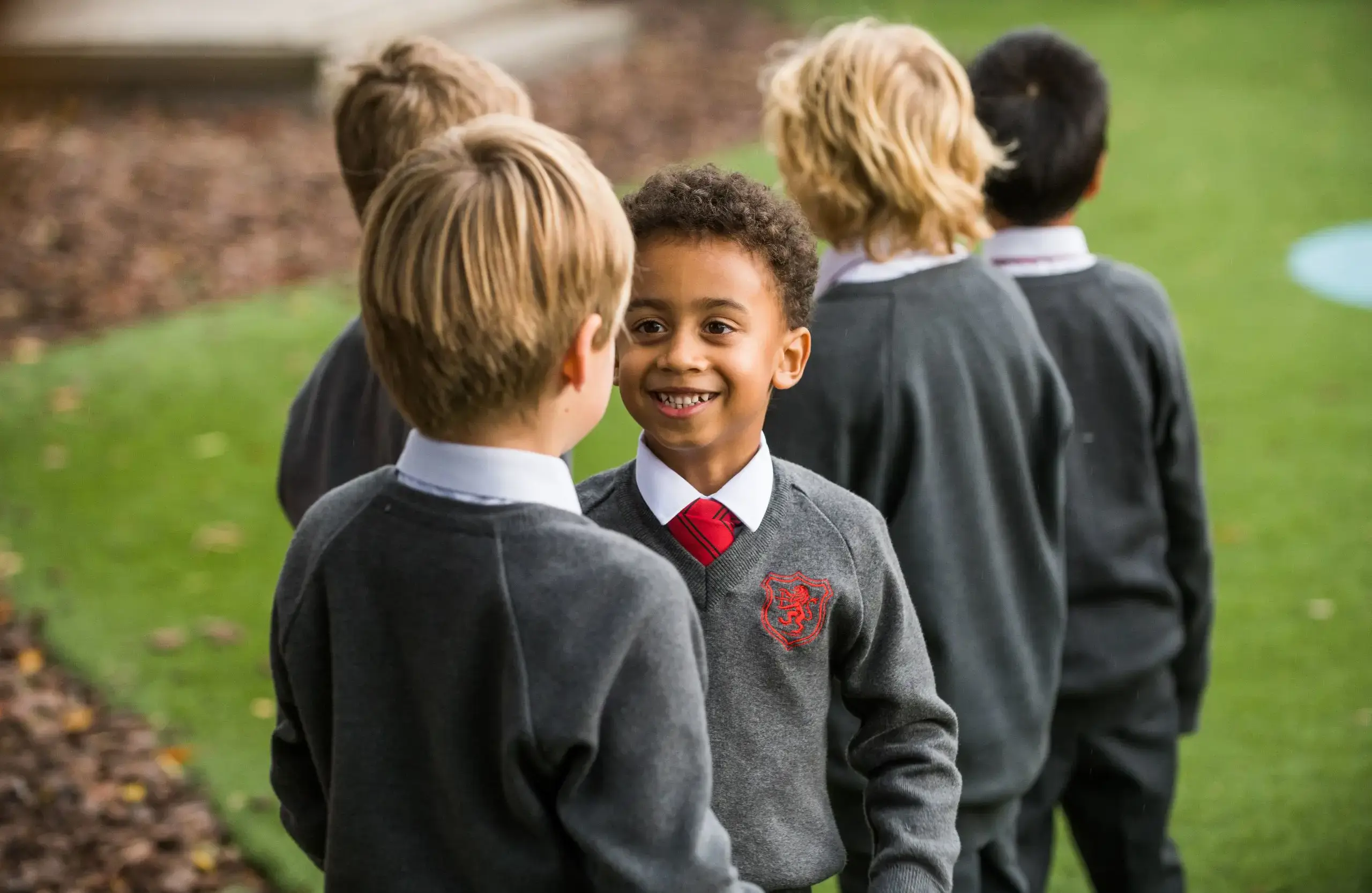 Shrewsbury House Pre-Prep students smiling in playground