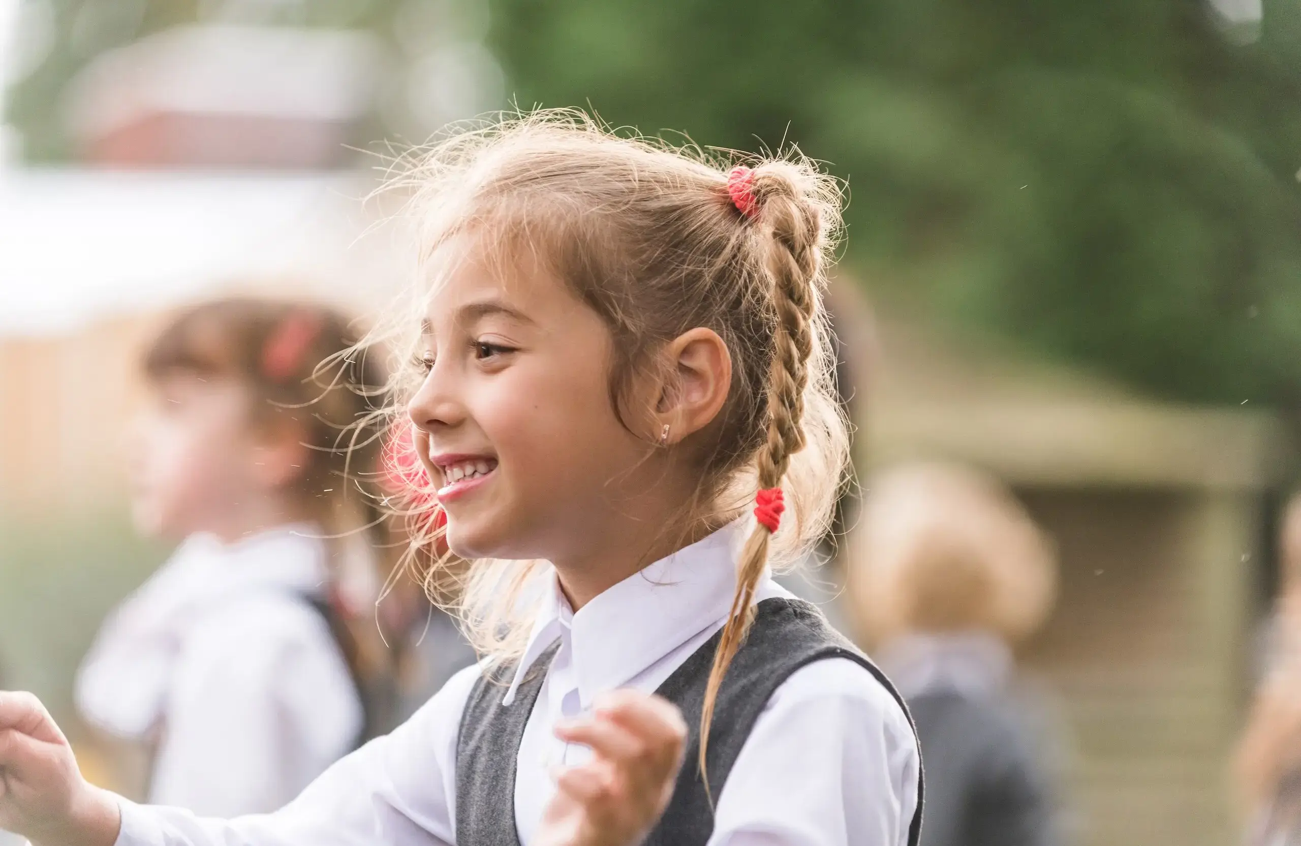 Student with braided hair smiling