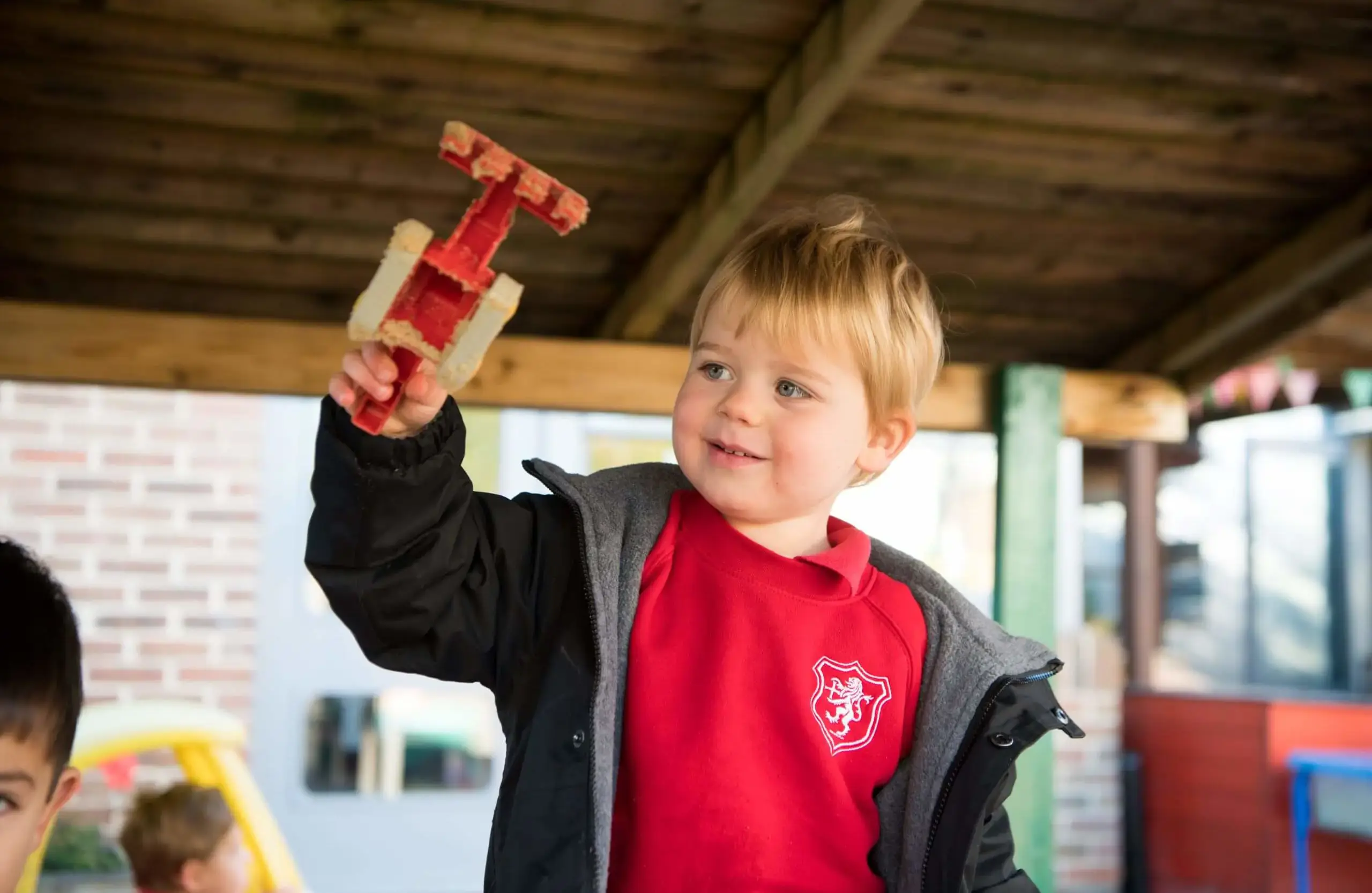 Shrewsbury House Pre-Prep student playing with a toy in the playground