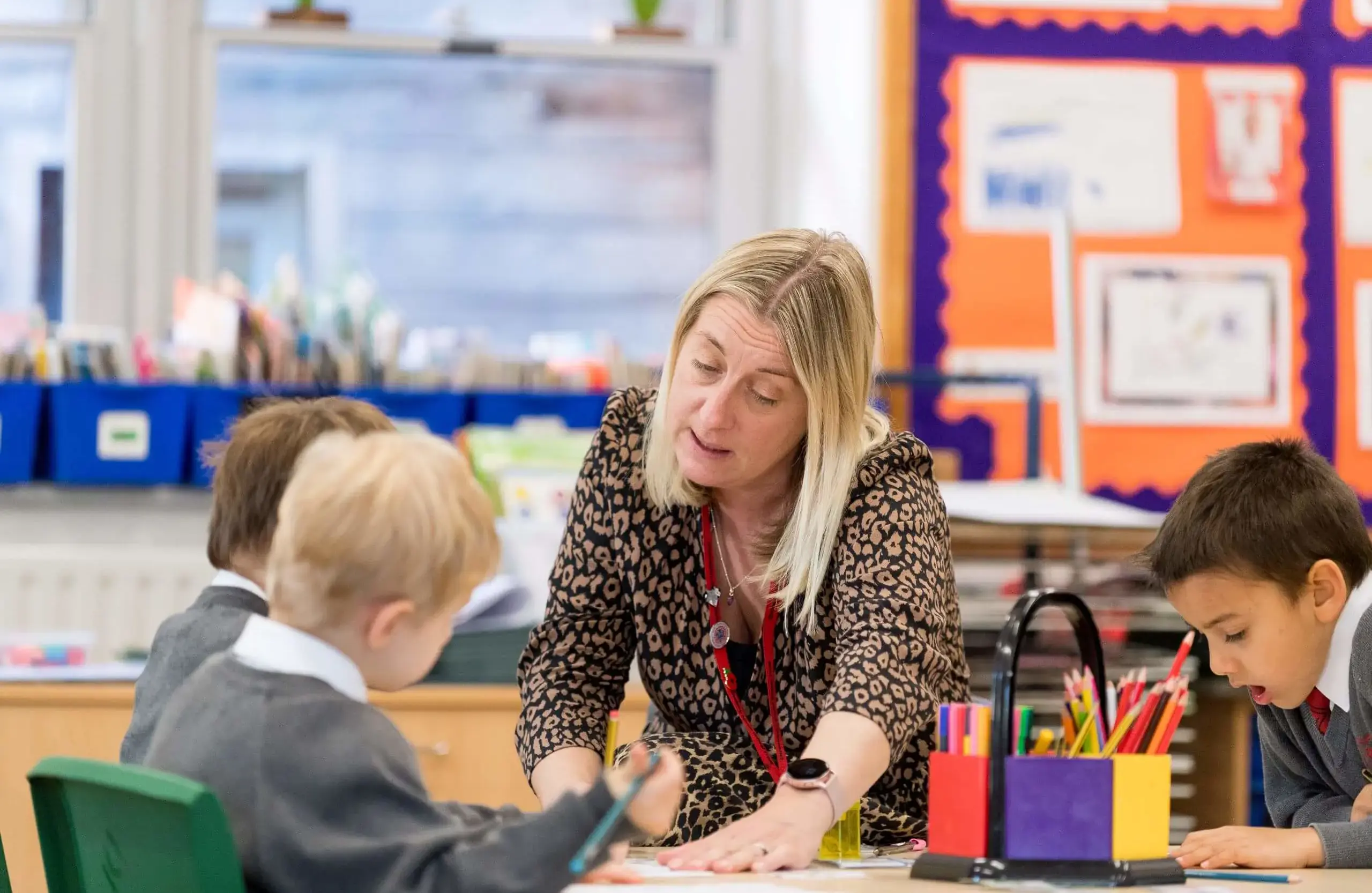 Shrewsbury House Pre-Prep teacher helping students with classwork
