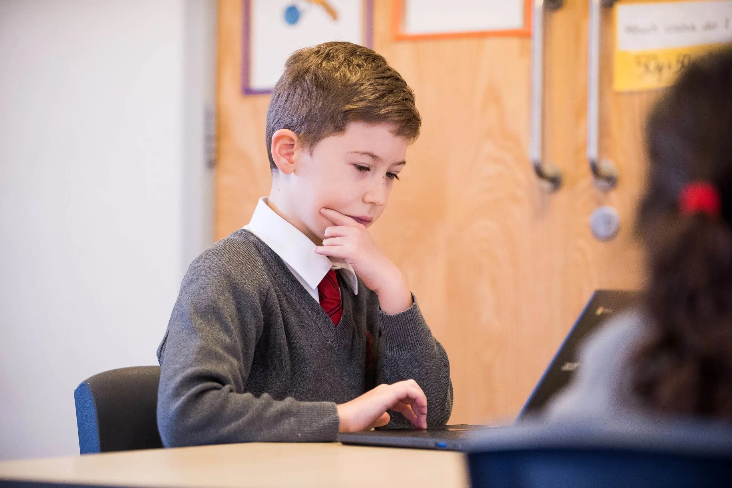 Shrewsbury House Pre-Prep Student using a laptop in an IT lesson