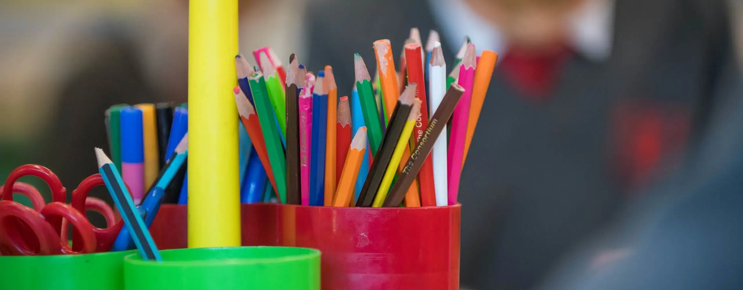colouring pencils in pot