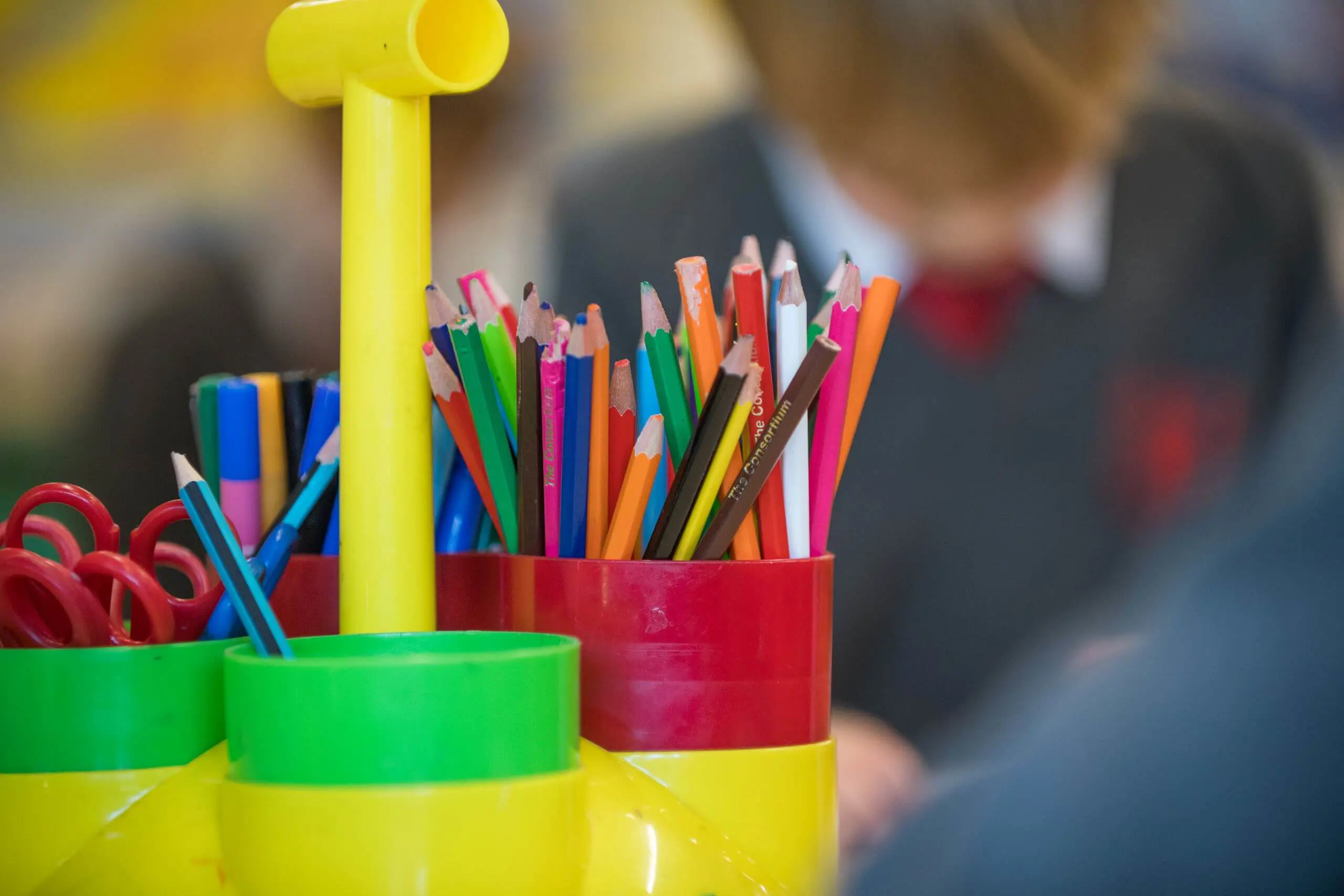 Shrewsbury House Pre-Prep colouring pencils in a pot