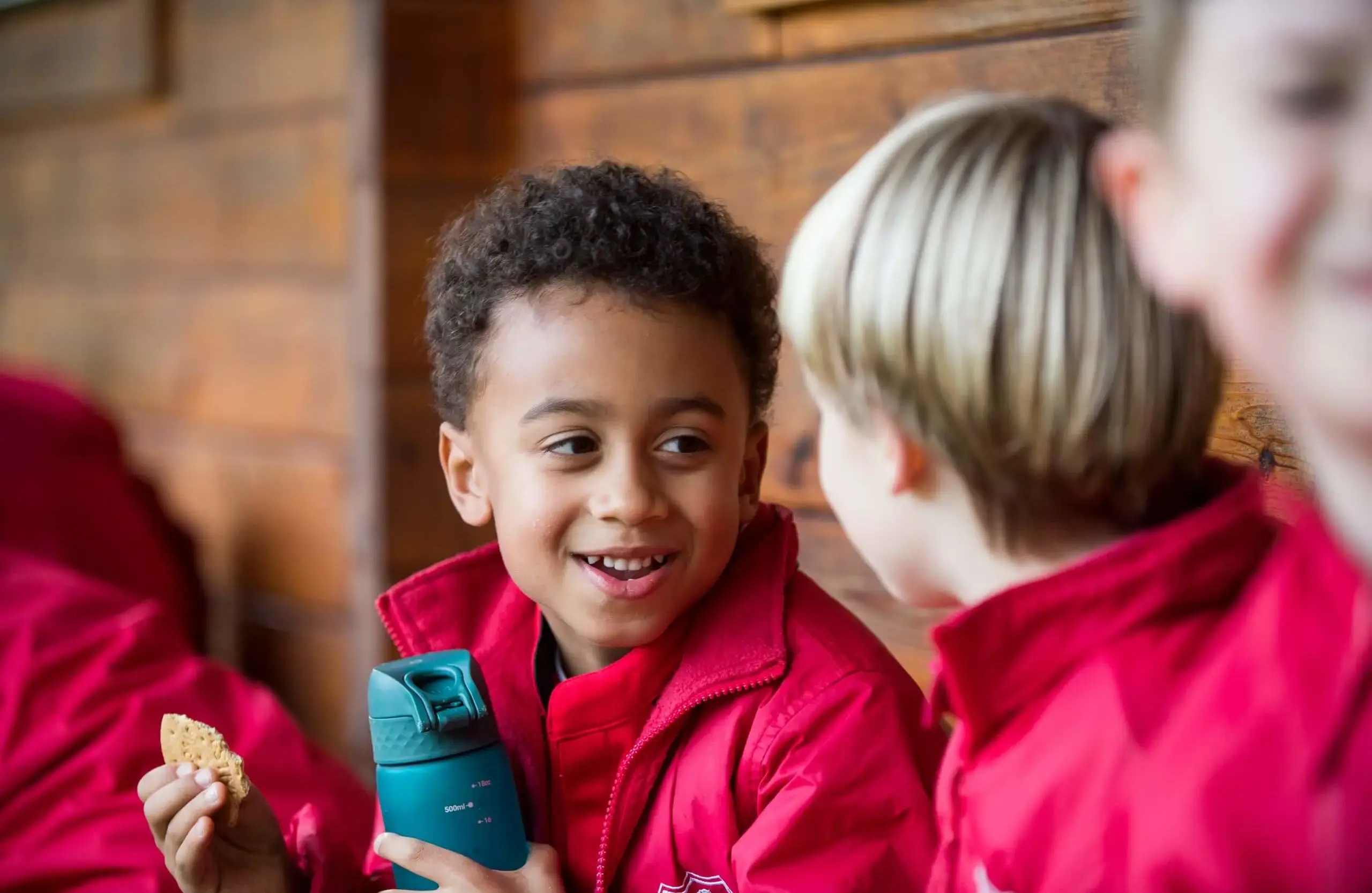 Shrewsbury House Pre-Prep student eating a snack outside