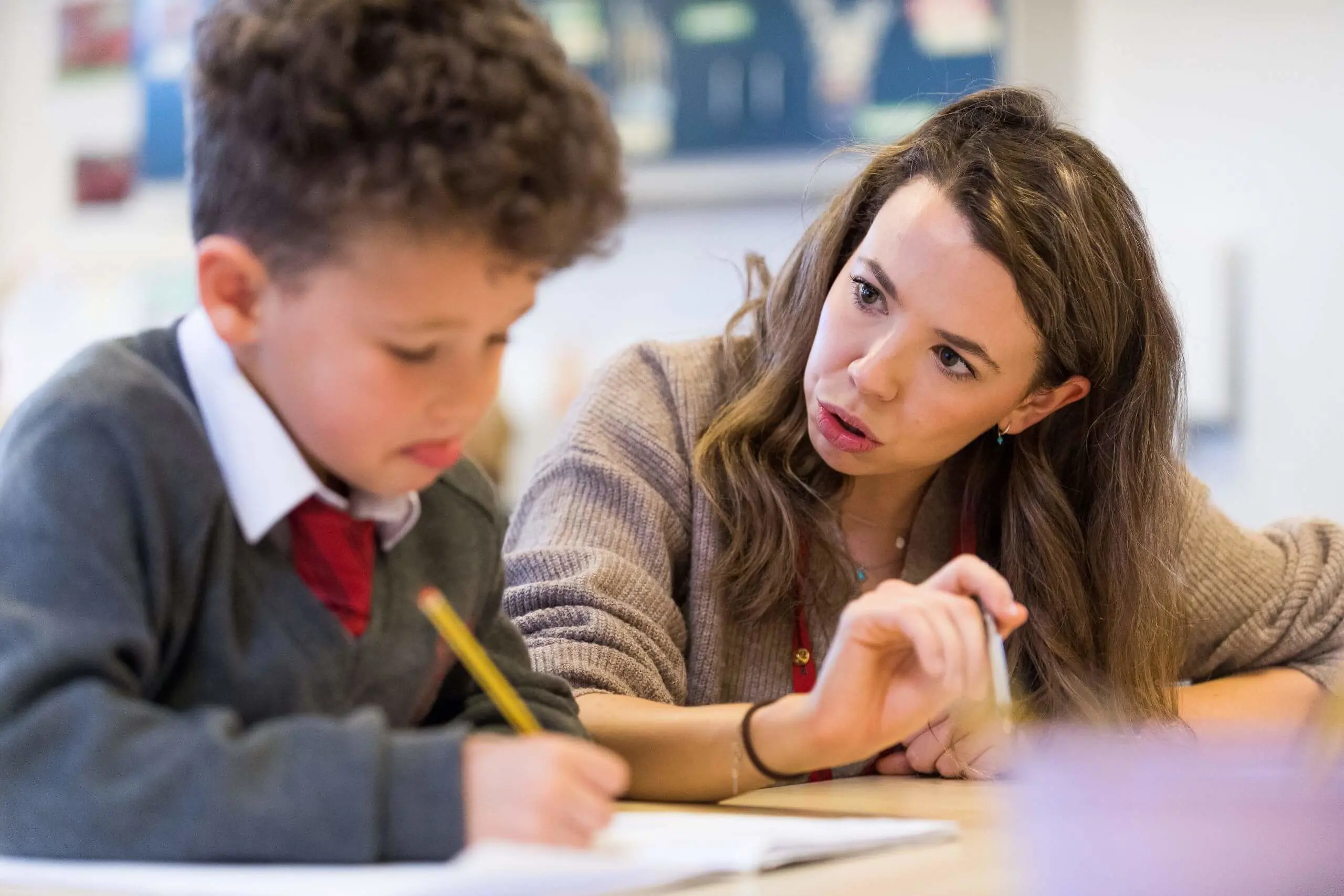 Shrewsbury House Pre-Prep teacher helping a student in a lesson