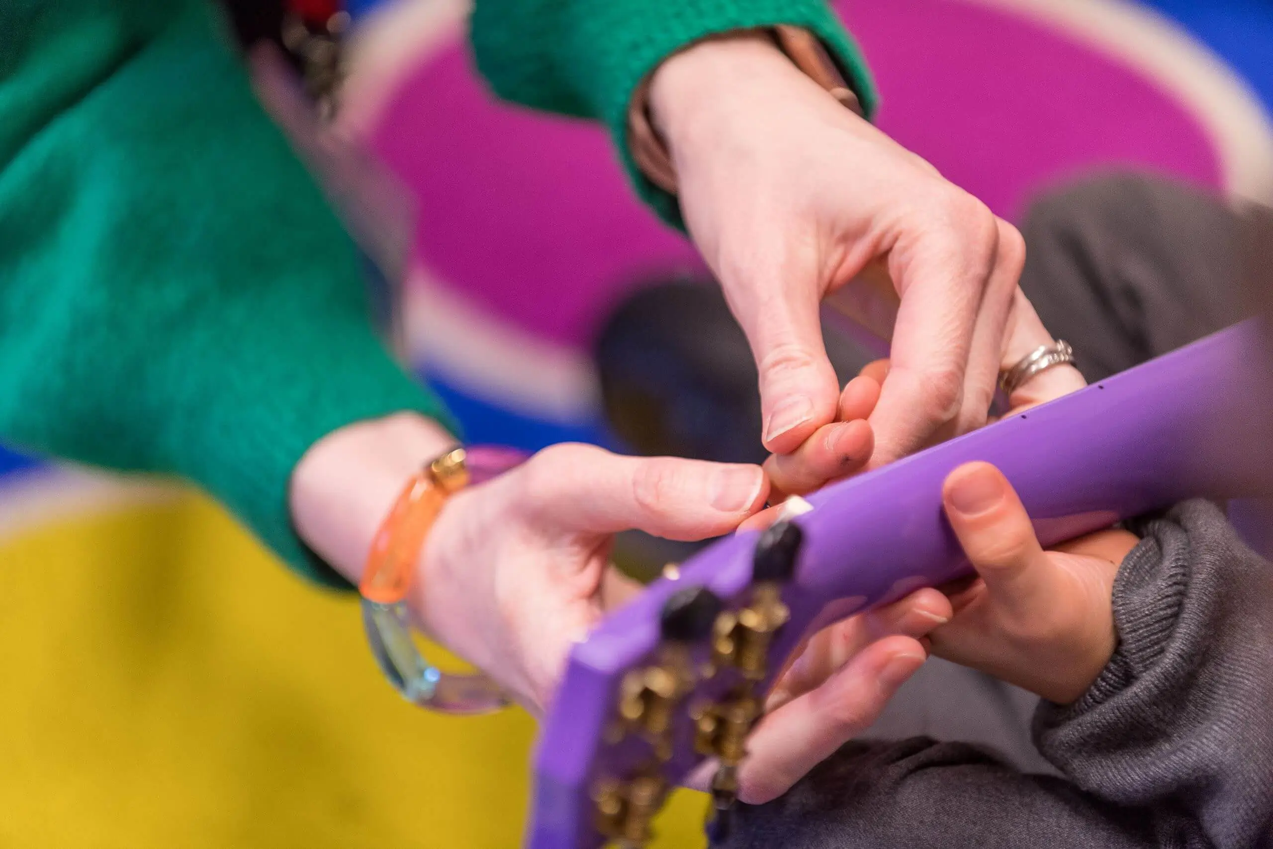 Shrewsbury House Pre-Prep teacher helping a student to play the Ukelele