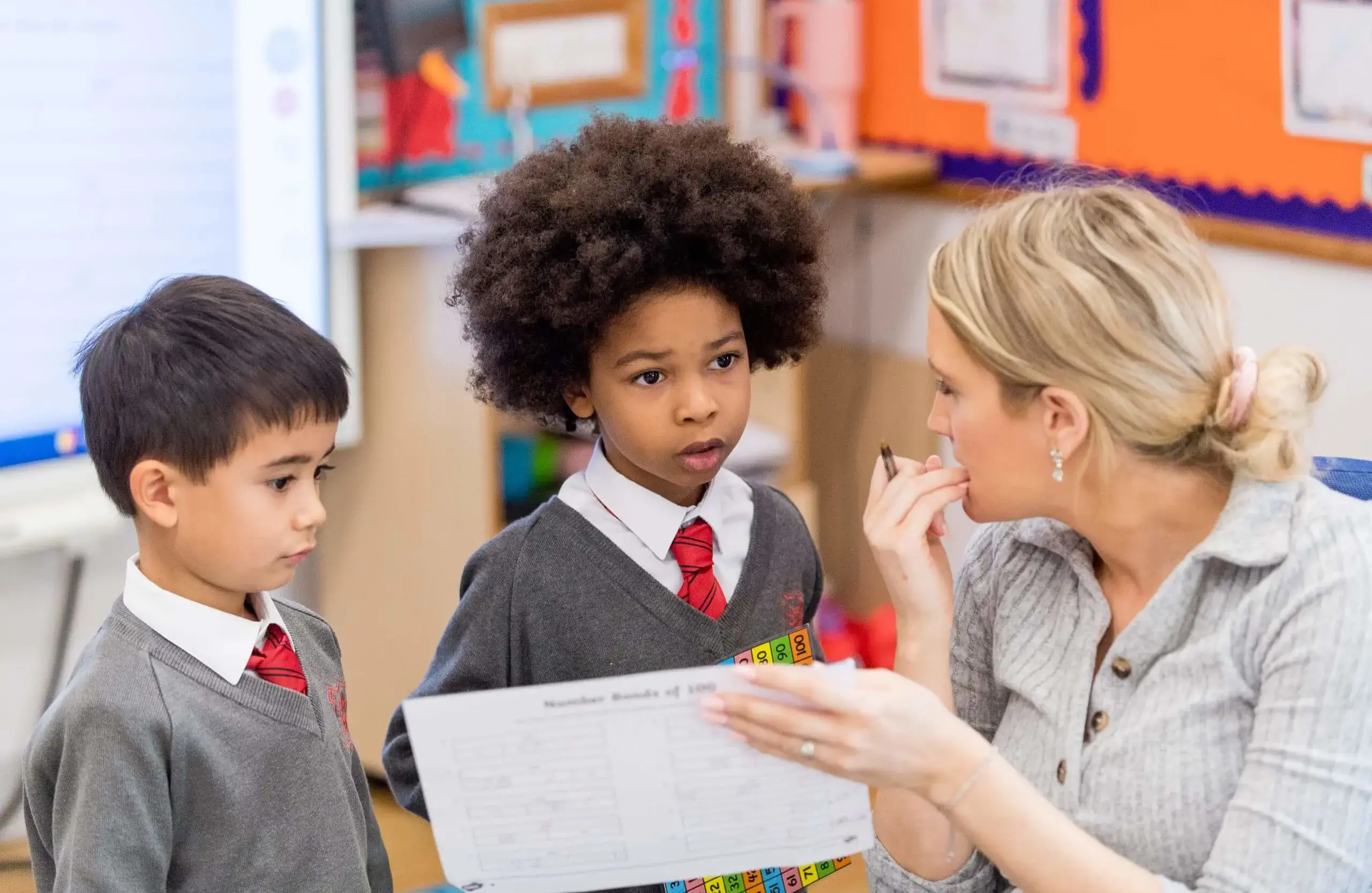 Shrewsbury House Pre-Prep teacher helping students in a lesson