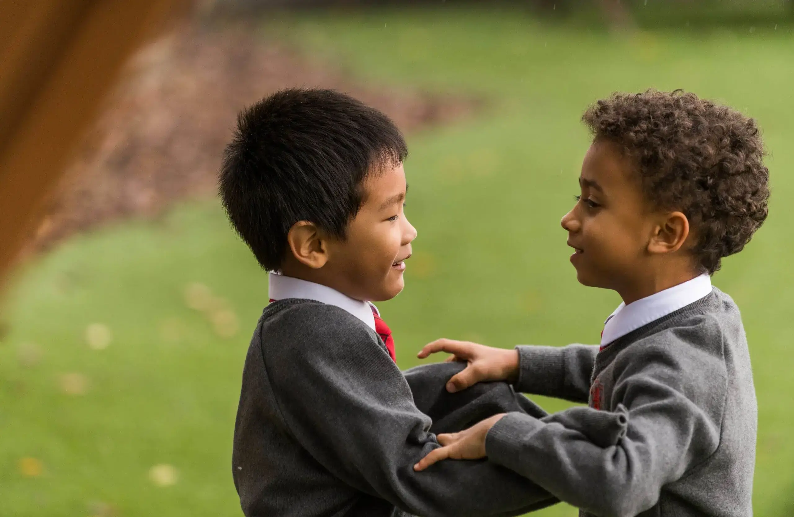Shrewsbury House Pre-Prep students playing on grass