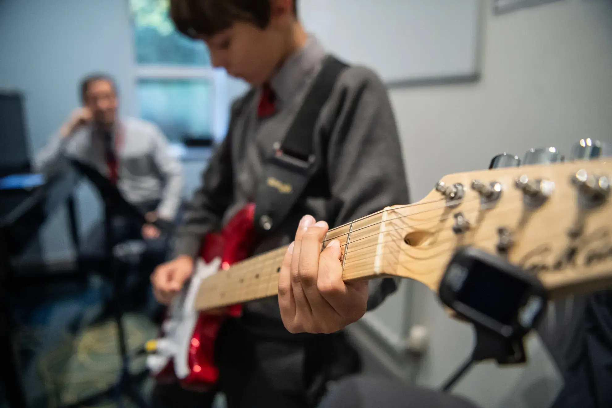 Student playing guitar