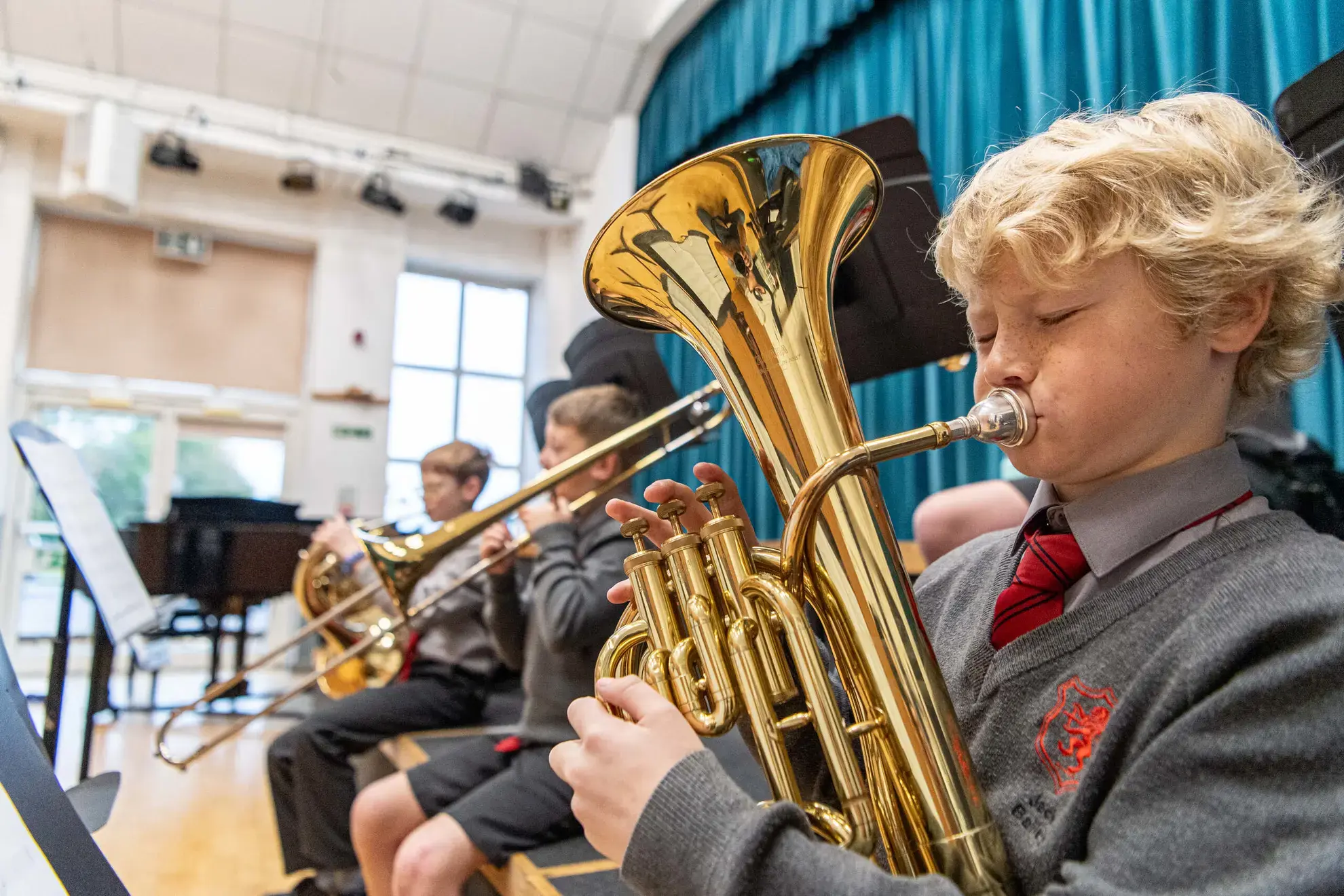 Students playing brass instruments