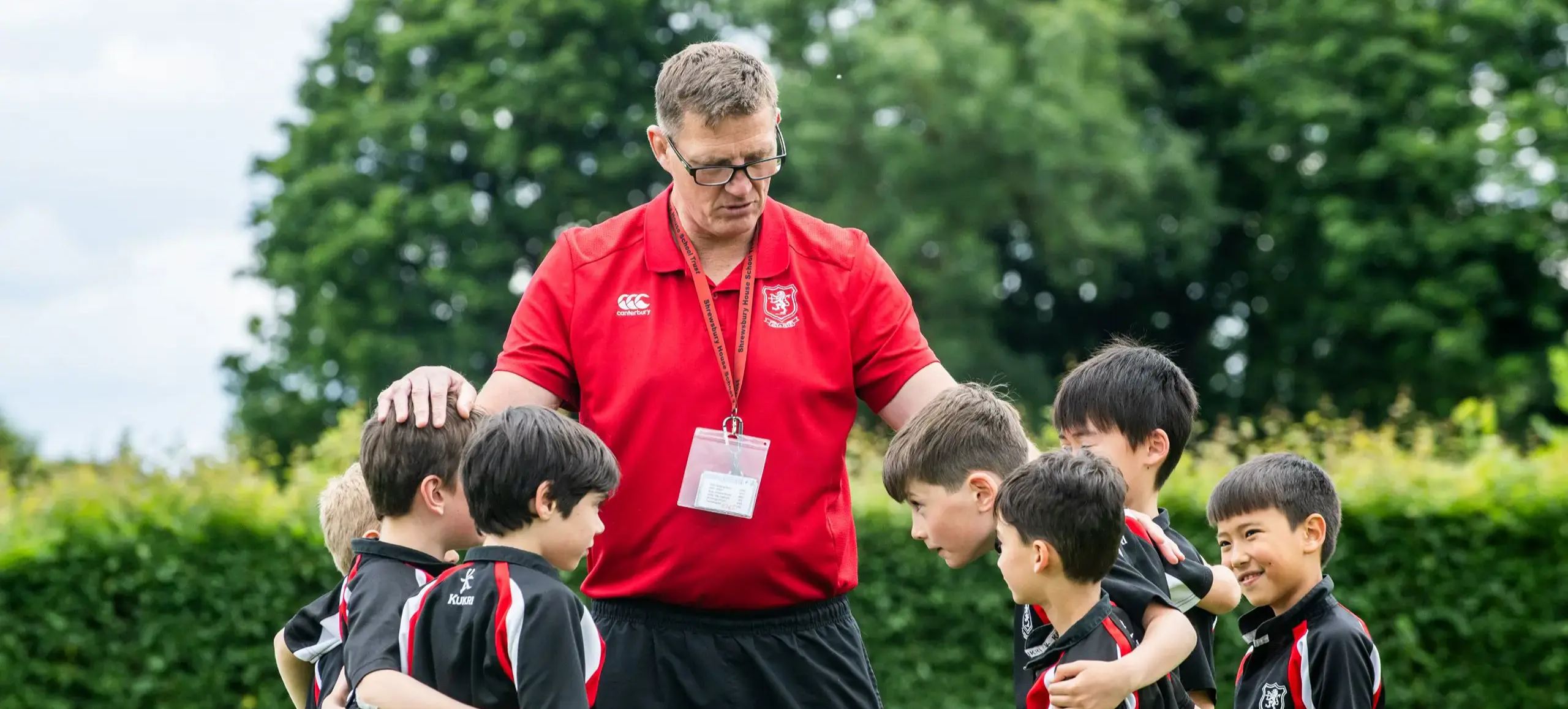Sports teacher with students