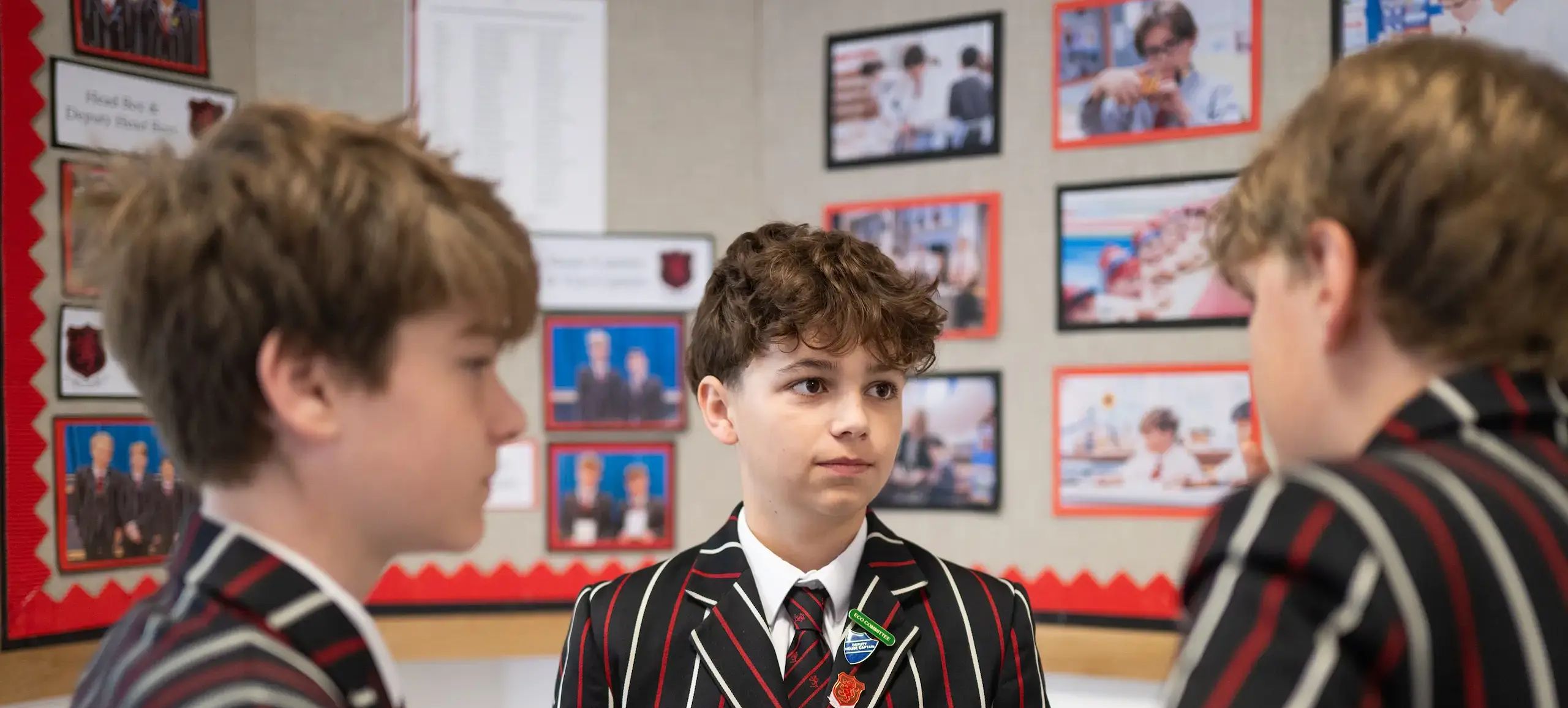 Three students talking 