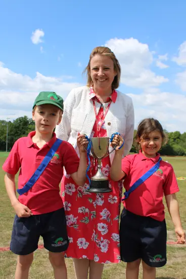 Sports day winners hold trophy