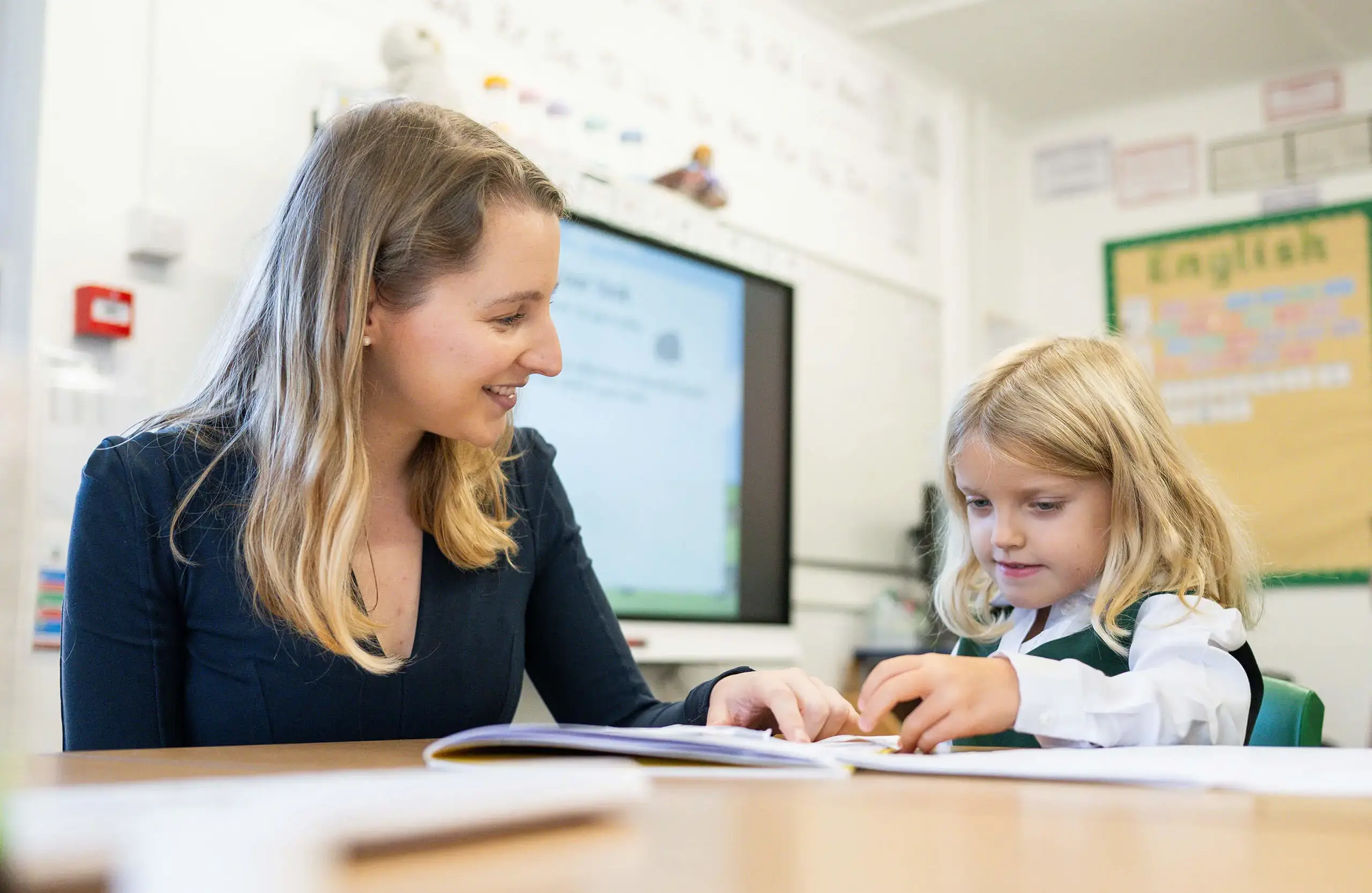 Teacher in class with pupil