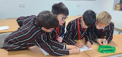 4 Students do maths problems